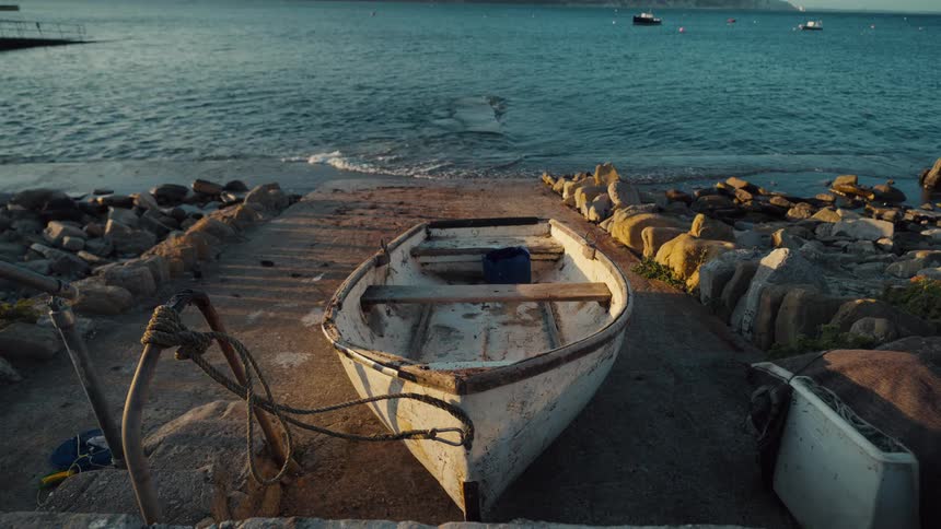 The rowboat is parked on the dock