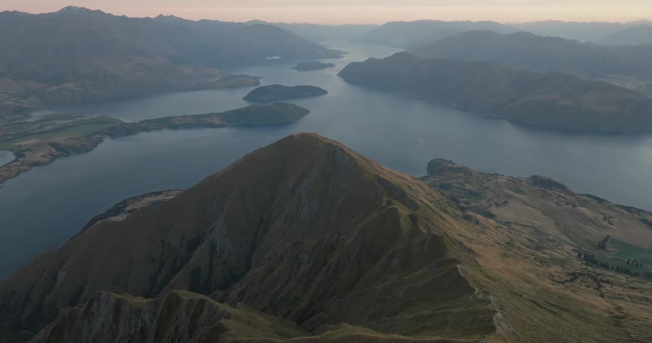 An aerial view of a mountain range near some lakes
