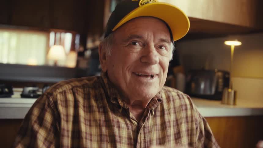 Cheerful elderly man gesturing with his hands