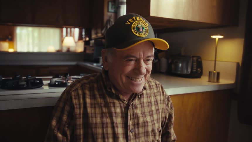 A man laughing in a room