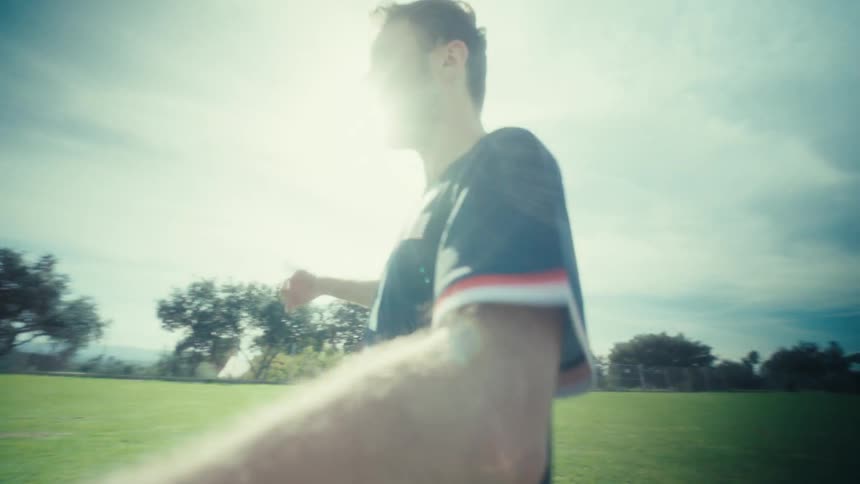 Two men playing soccer