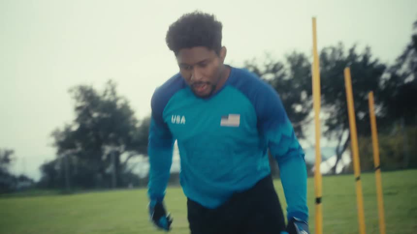 A man playing soccer outdoors