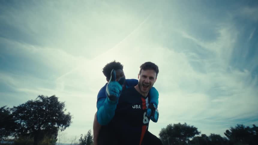 Two soccer players cheering