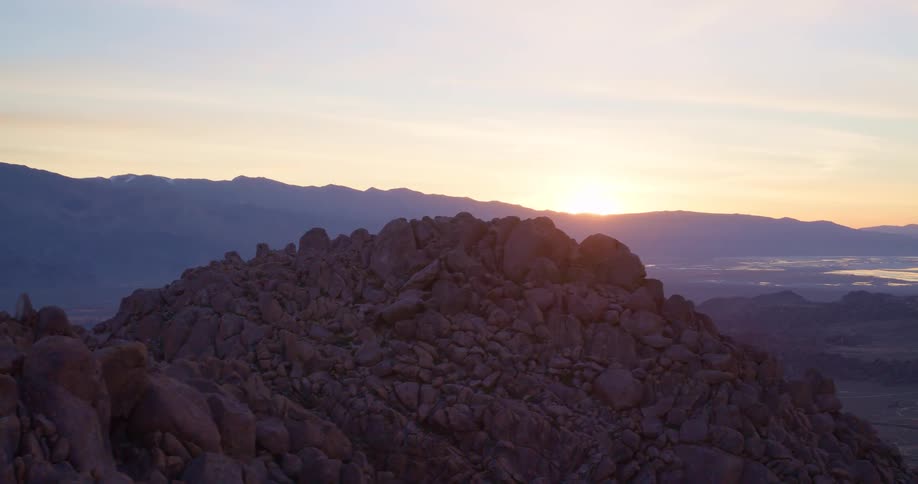 The sun rises above the mountains