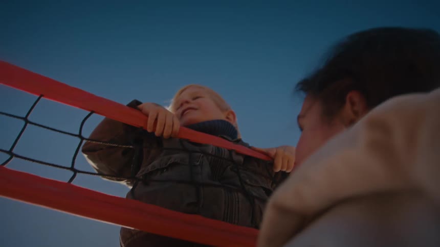 A mother talking to her son outdoors