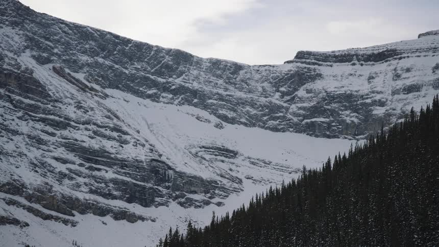 Forested mountain with mountains in the distance