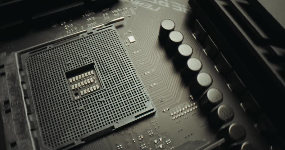 Processor socket on a motherboard with aligned capacitors and visible electronic traces