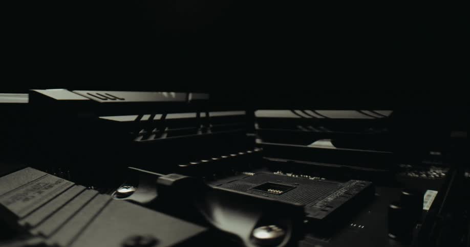 Computer hardware surrounding an empty cpu socket is silver and black