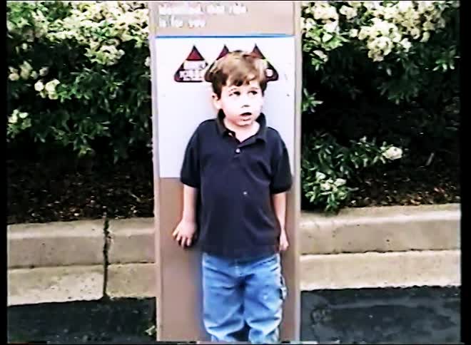 Boy being measured at amusement park