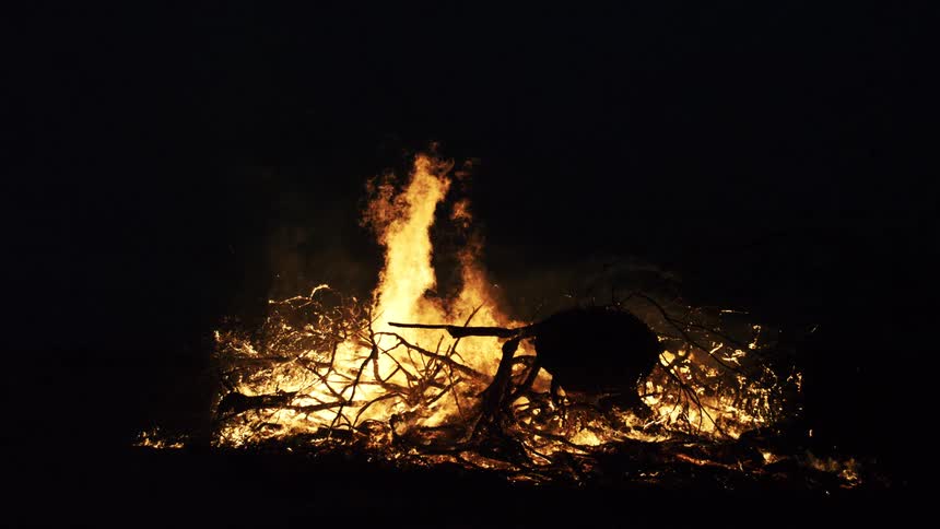 Bonfire with strong flames lighting the night
