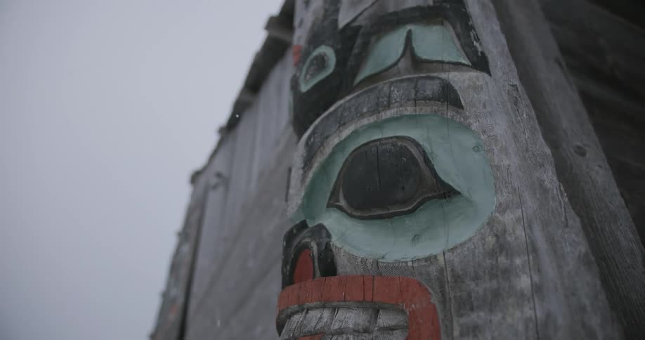 Wooden totem with an artistic stylized face