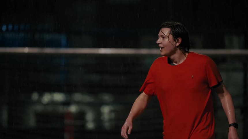 A man running outdoors at night
