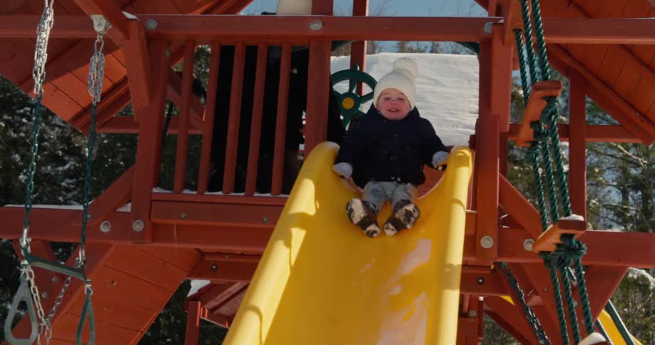 A child sliding down a slide