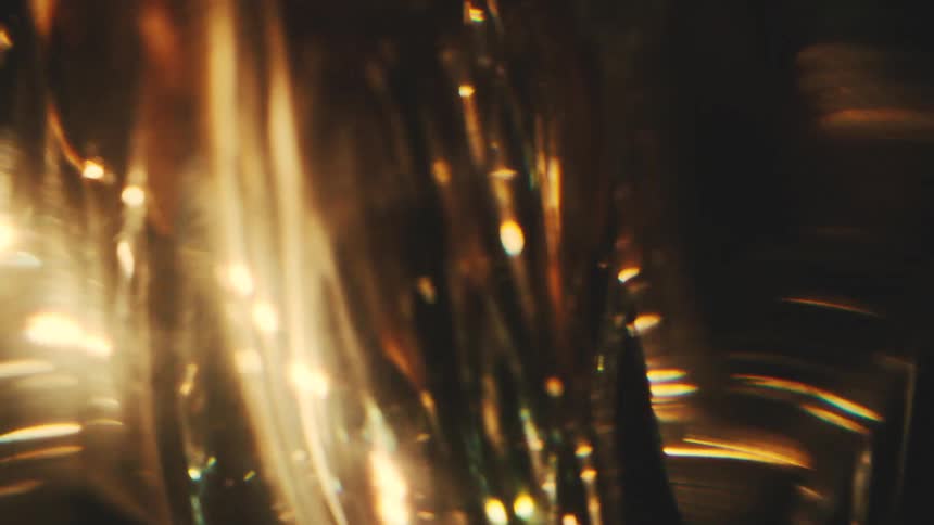 Light is reflecting off the piece of gold