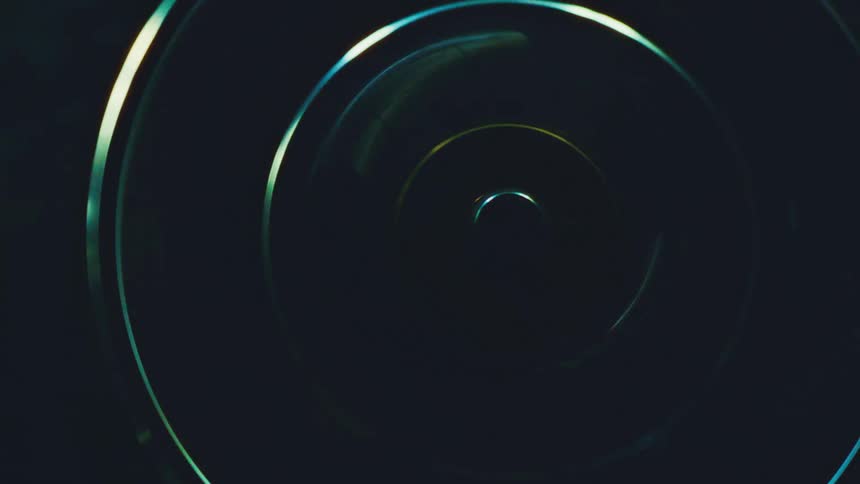 A rotating ring with multiple internal glass elements spinning rapidly