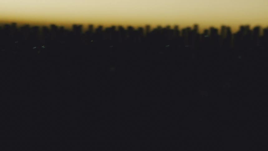 Outoffocus light dots forming circular pattern over dark background