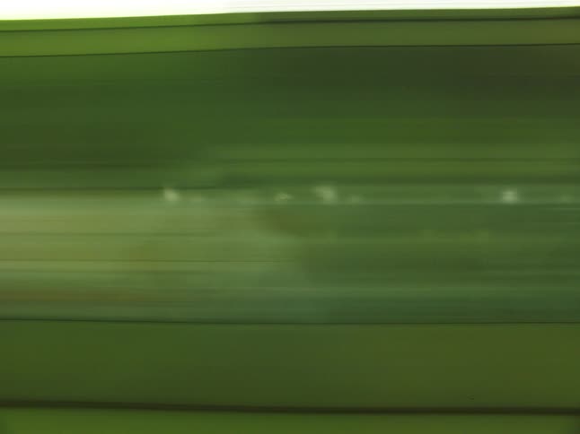 The buses passes by in the city at night