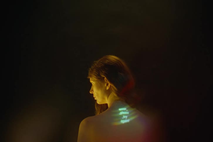 The green light flashes on the woman