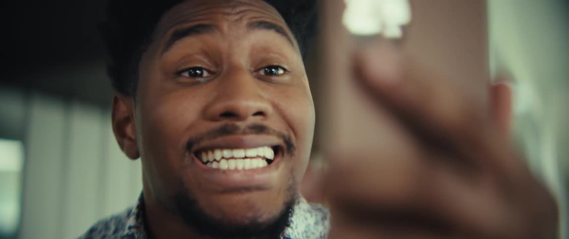 Man talking on a video call inside his house