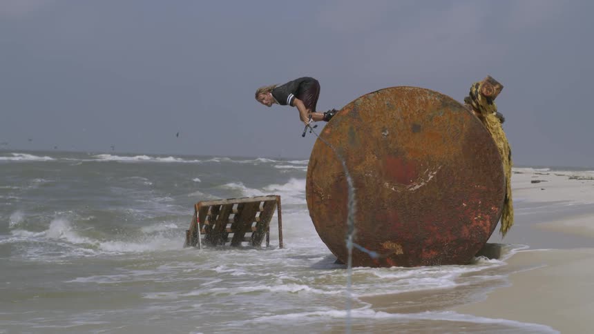 A man performs a jump on water while being pulled