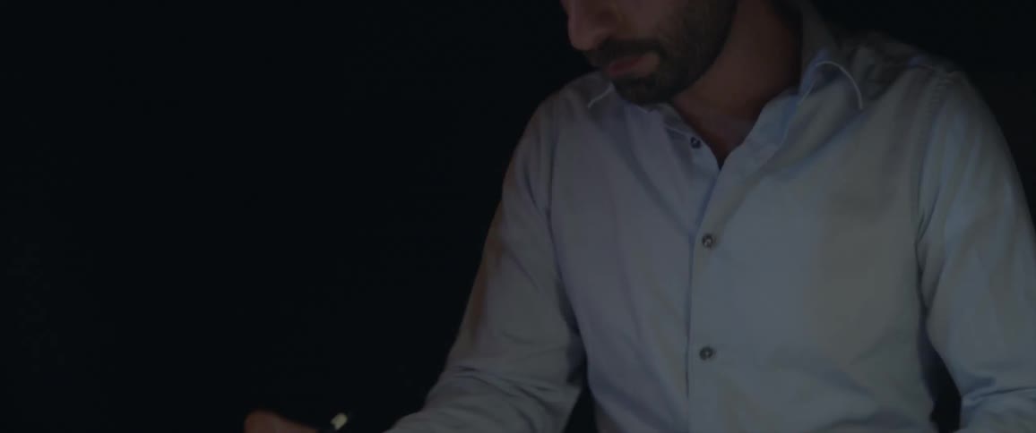 A man sketches plans with a pencil