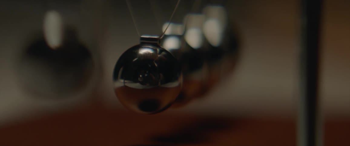Newton's cradle balls swinging back and forth