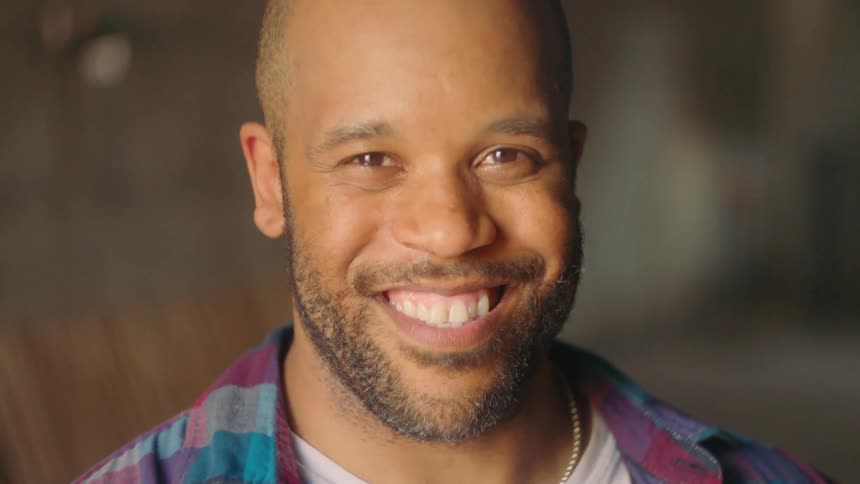 A man smiles