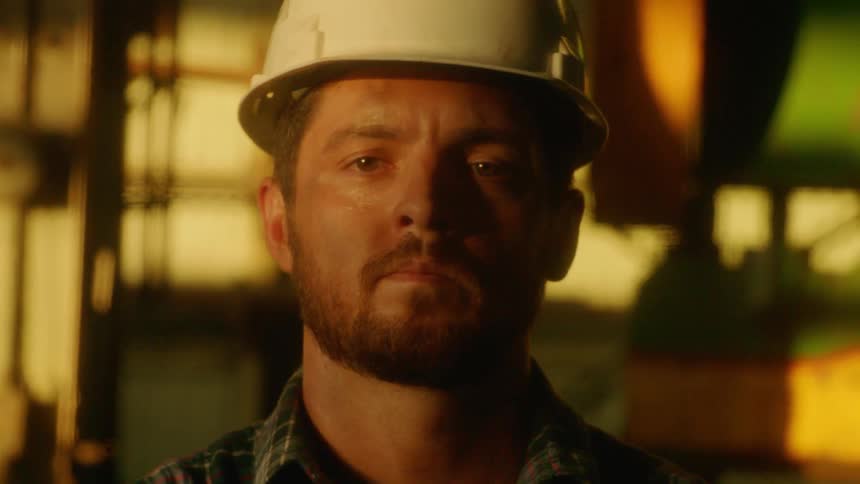 A construction worker wears a hard hat on site