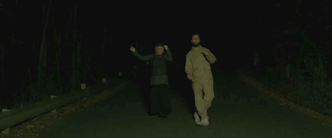 People dancing in the dark with flashing lights
