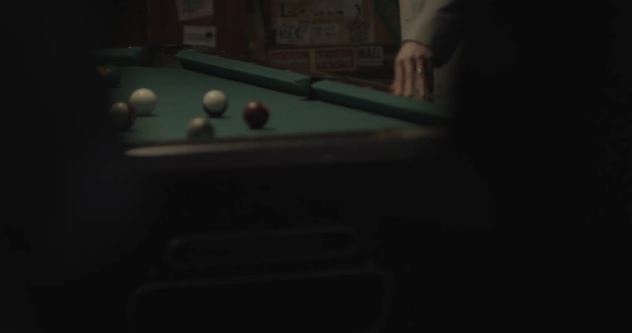 Two people play pool