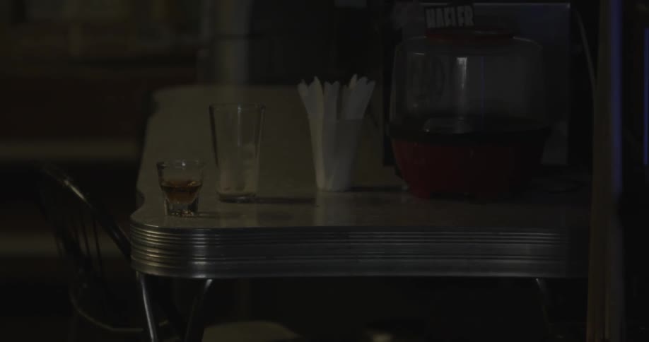 Used glasses sit atop a diners table