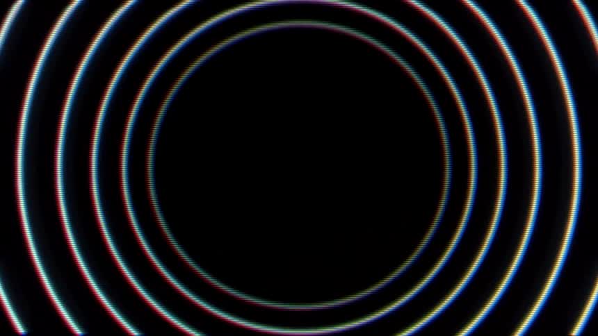 Pale circles appear creating a series of concentric circles against a black background