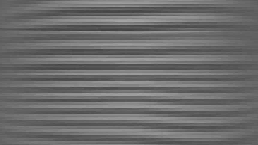 A close view of a grey screen with a pattern of many fine horizontal lines that flicker and move slightly