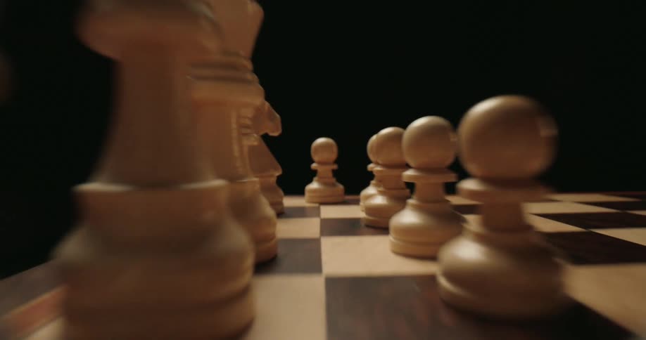 Closeup of white pieces on a chessboard
