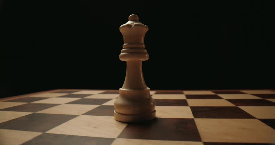 Single chess piece over a chessboard indoors