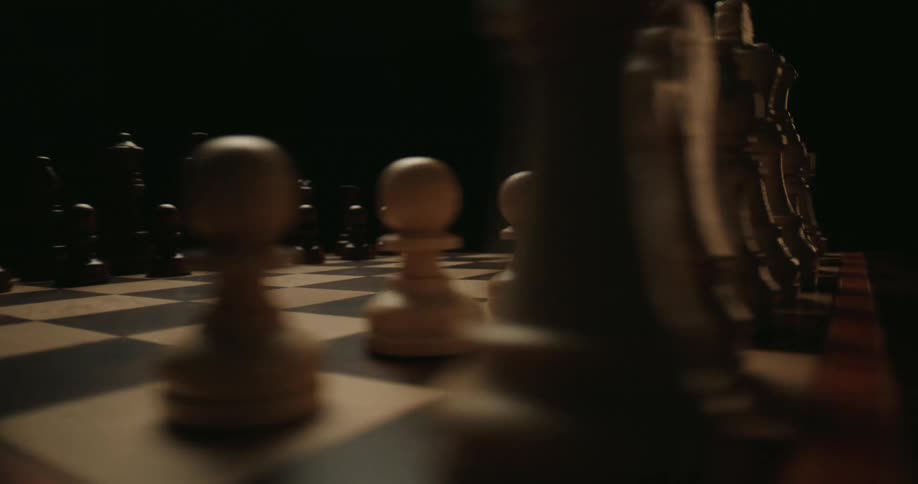 A close up orbiting a chess board