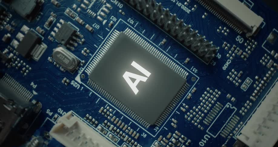 Blue motherboard with the letters a and i written over the processor indoors