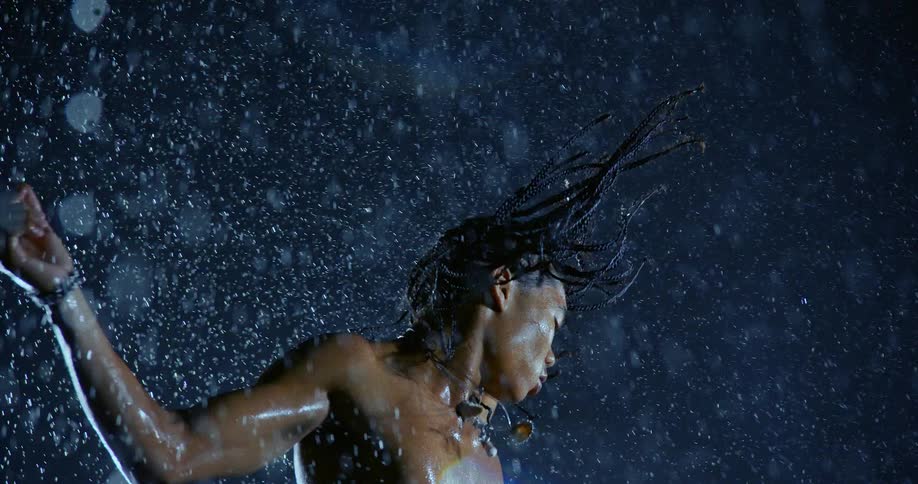 A man jumping in the rain