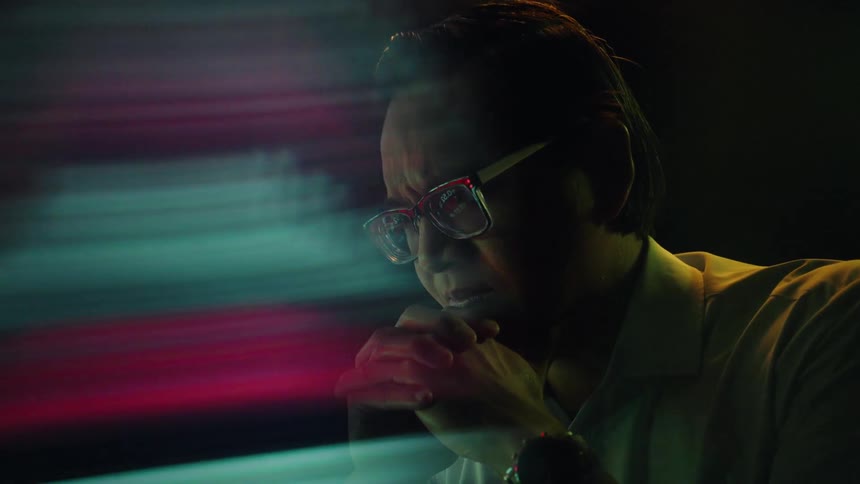 A man sitting in a room thinking