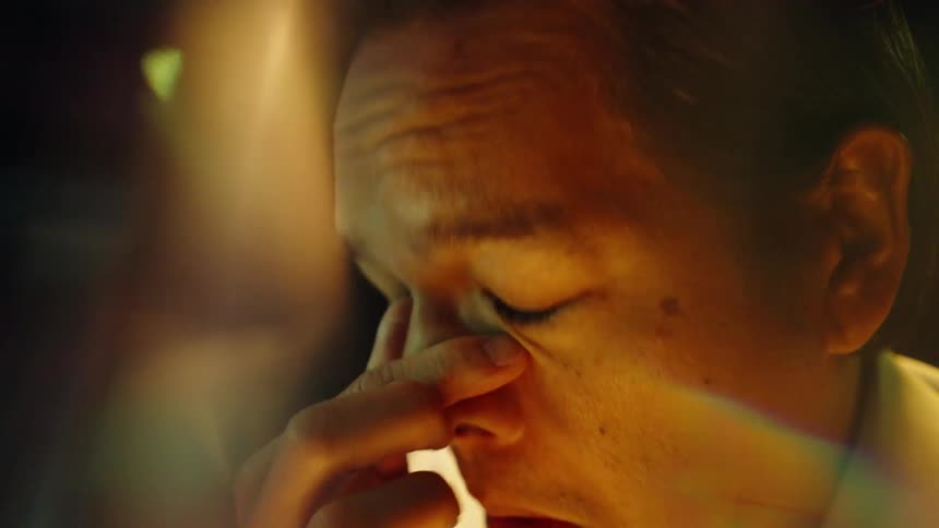 A man thinking while looking at a screen