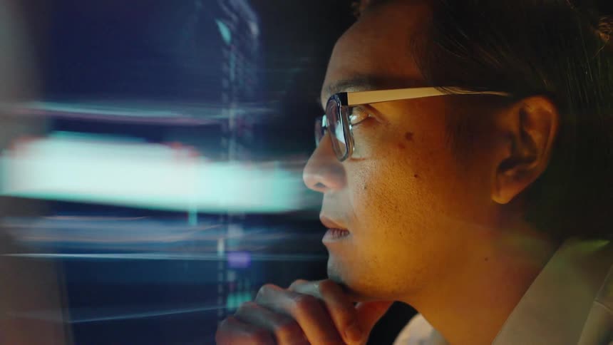 A man looking at a computer screen