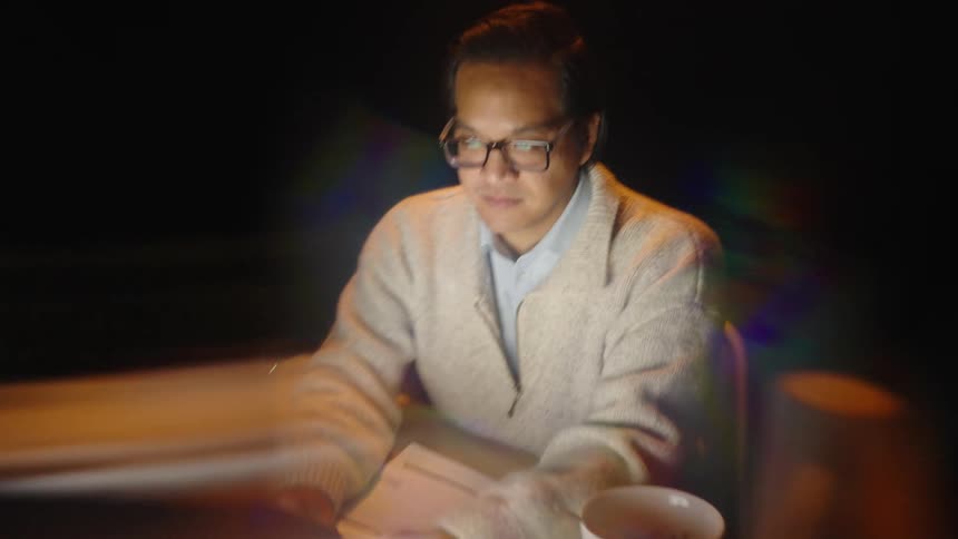 A man using a computer at a desk