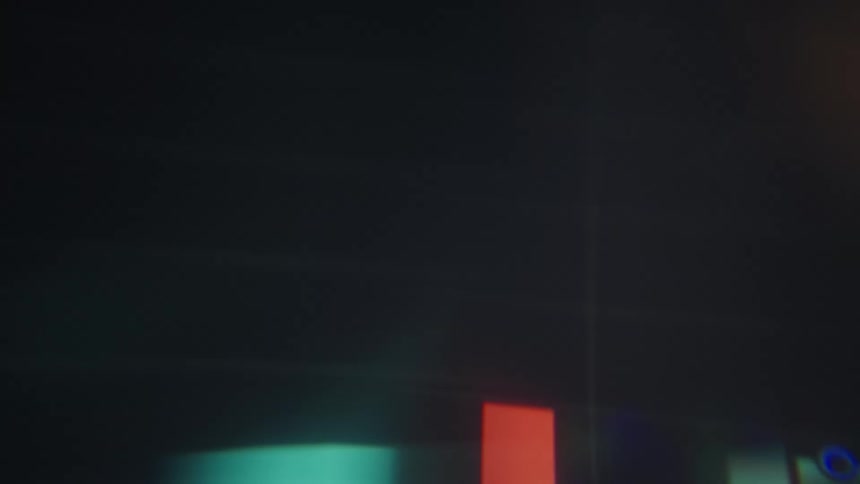 Financial charts on a screen indoors