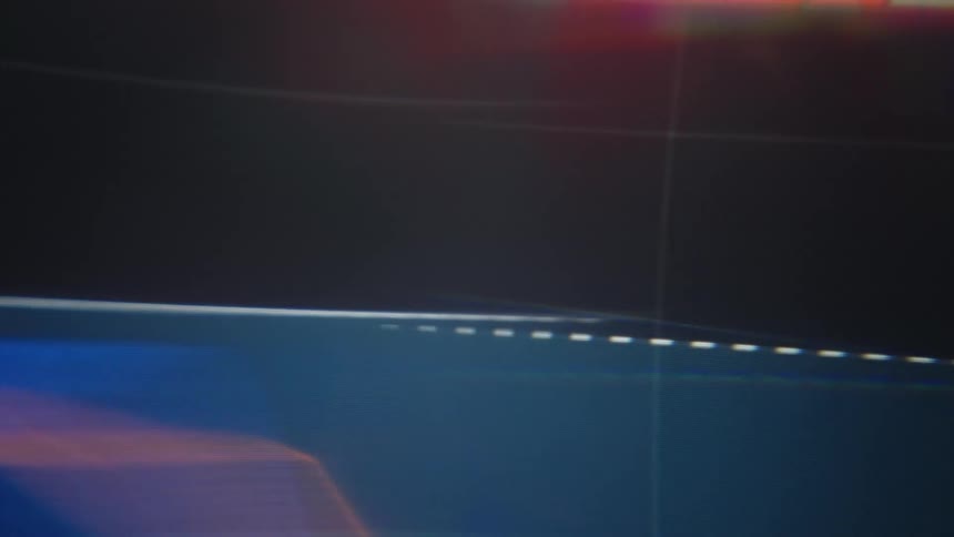 A computer screen showing a stock chart with indicator lines