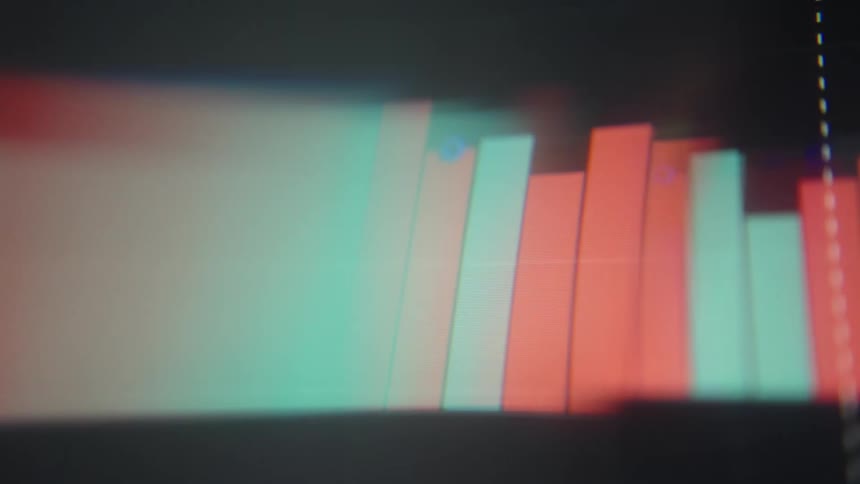 Financial chart bars in green and red tones with blur