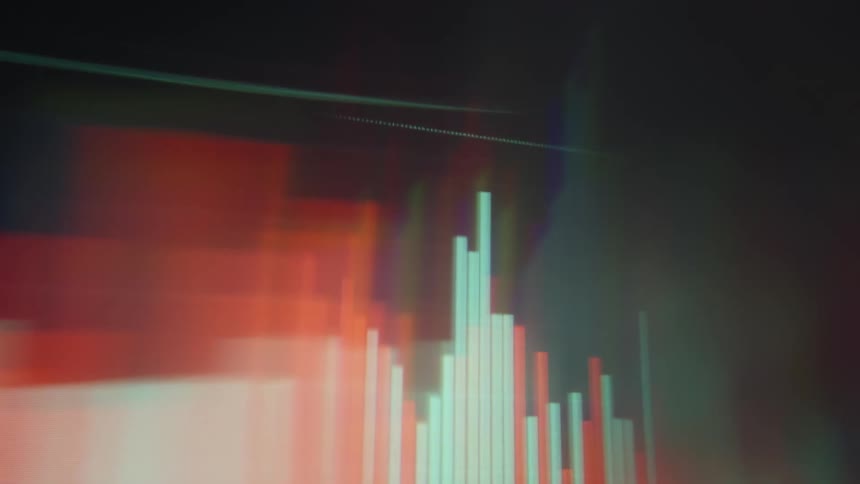 A rapid blurry pan across a digital financial interface showcases glowing orange and teal bar graphs and fluctuating data lines that shift through heavy motion blur and vibrant light leaks