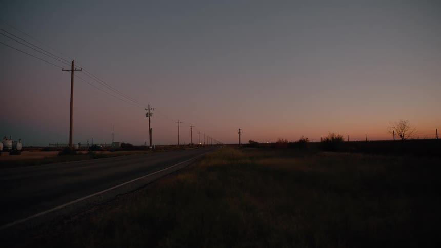 The highway is lined with power lines