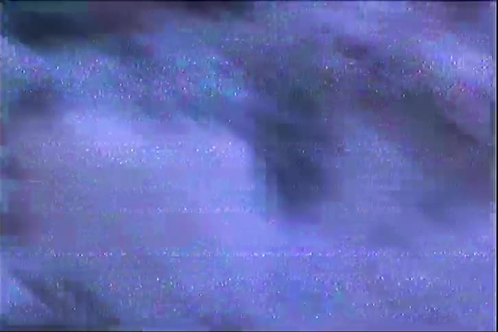 Dark surface covered with irregular patches of snow and ice