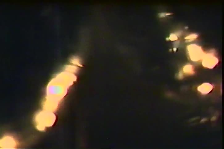 Illuminated spherical globe spinning in a dark environment