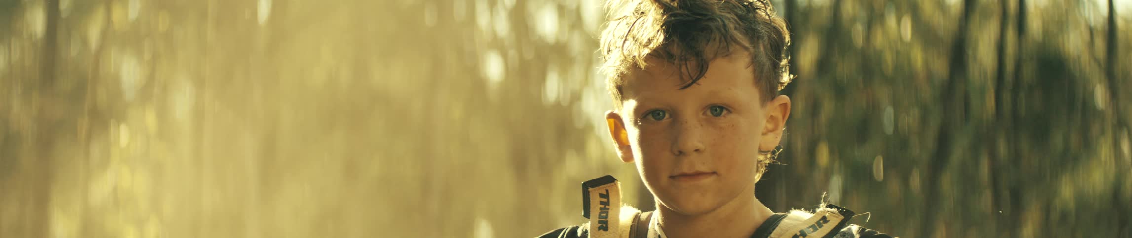 A child outdoors on a sunny day